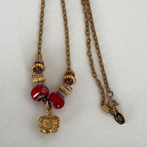 Gold-Tone Tutti Frutti Necklace with Red Bead Accents and Crown Charm